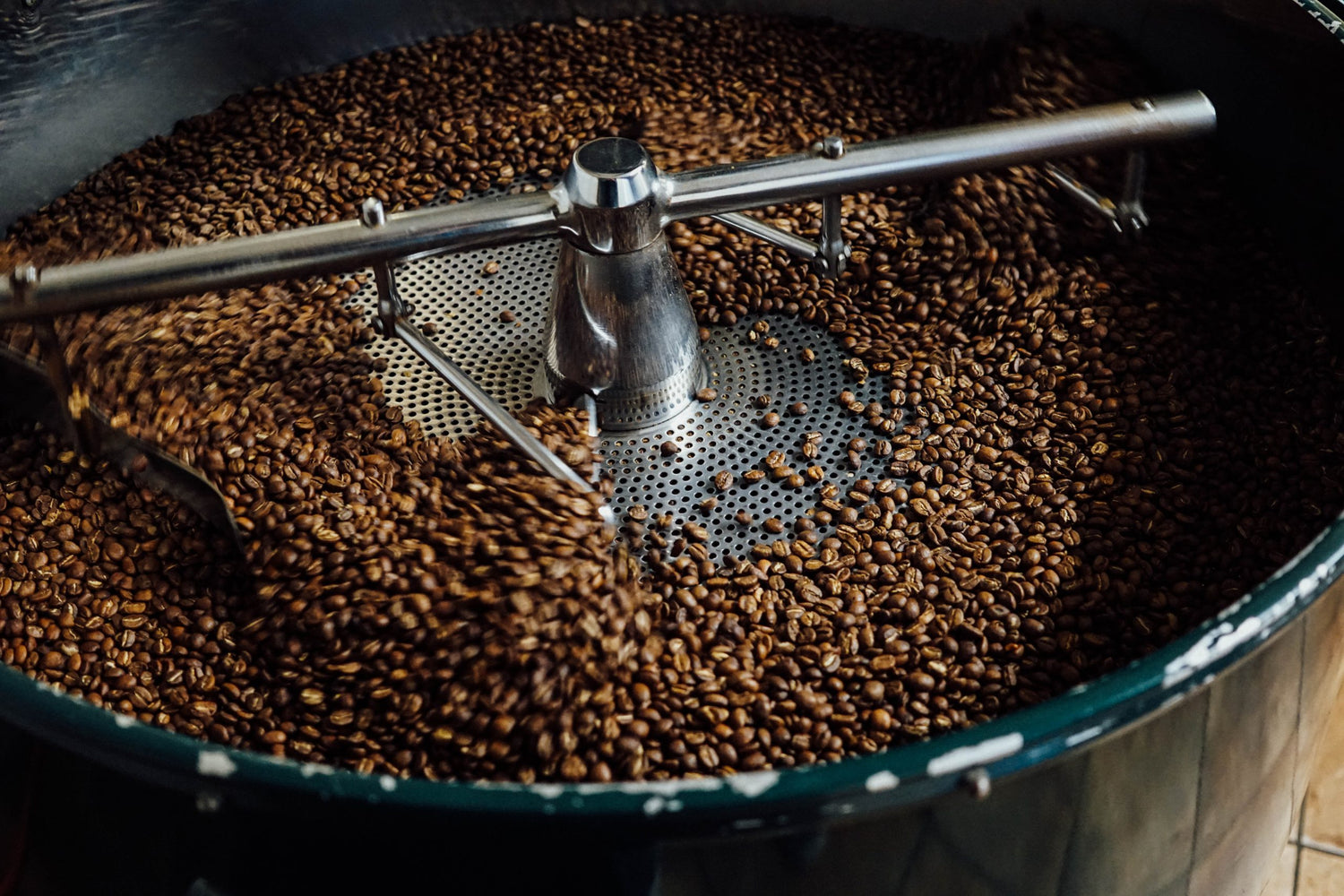 Coffee beans in the grinding process.